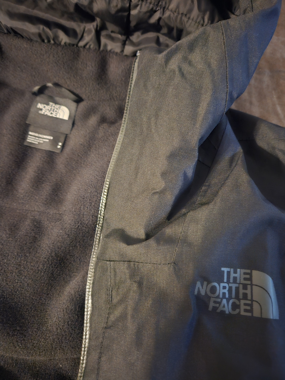 The North Face Men's Black Raincoat with Reflective Logo